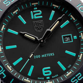 Watch face with black dial and turquoise accents, featuring the Luminox logo.